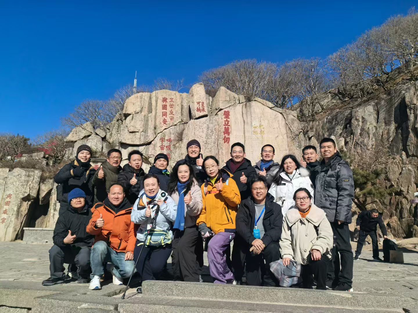 A group of people posing for a photoAI-generated content may be incorrect. A group of people posing for a photoAI-generated content may be incorrect.